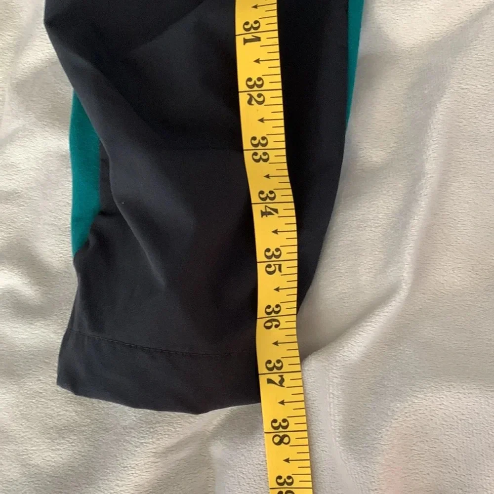 Oakley’s mens size 32 performance fit black athletic pants teal contrast back